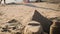 Sandcastles in shape of pyramids on a beach.