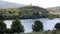 Sandeman silhouette on a hill over vineyards, across Douro River, Peso da Regua, Portugal