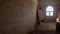 Sandfilled room broken door and window at the forgotton ghost town of Kolmanskop, Namibia