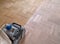 Sanding parquet with the grinding machine