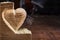 Sanding wood heart close