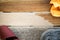 Sandpaper and oil cloth lying on wooden garden table after sanding and oiling