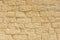 Sandstone brick wall background.