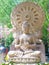 Sandstone Buddha image sitting front Dharmacakra