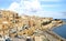 Sandstone buildings in the old harbor and Victoria Gate in Valetta