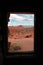 Sandstone Cabin Window to Desert Landscape