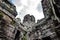 Sandstone carvings depicting a person\\\'s face on a walkway in Bayon Temple in Angkor Thom, Siem Reap