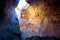 Sandstone cave with narrow opening above