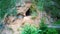 Sandstone Caves in Ligatne, Latvia. View to Cave Rock Lustuzis LustÅ«zis on the Bank of Ligatne River.