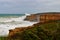 Sandstone cliffs with big waves on Great Ocean Road