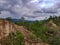 sandstone cliffs rock sandstone rainforest trees dark cloud sky mountains hills tour pai canyon north chiang mai thai
