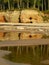 Sandstone cliffs on the seashore, beautiful reflections in the water