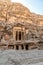 A sandstone facade of a building at Little Petra, in Jordan