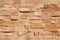 Sandstone facade seamless pattern on a textured stone wall brick background.