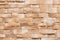 Sandstone facade seamless pattern on a textured stone wall brick background.