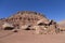 Sandstone house in ruins, boulders and mountain in Cliff Dwellers