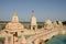 Sandstone mandapas around the artificial lake at Neelkanth Dham Swaminarayan Temple, Poicha, Gujarat, India, located at Poicha