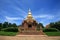 Sandstone pagoda statue against blue sky