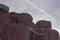 Sandstone Redrock with Clouds Contrail and Snow Patches