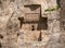 Sandstone rock with carved tombs of persian kings in Necropolis, Iran. King burial site of ancient Persia. Zoroastrian