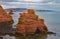 A sandstone sea stack at Ladram Bay near Sidmouth, Devon. Part of the south west coastal path. Sidmouth is visible in the