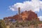 Sandstone Spire Protruding out of a Red Rock Ridge