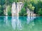 Sandstone towers reflected in water of Vezak pond