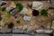 Sandstone walls and stones in a flowerbed in a terraced terrain with stairs. flowering rock gardens and stairs with a gravel surfa