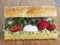 Sandwich baguette with strawberries mozzarella cheese and guacamole closeup