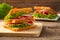 Sandwich bologna sausage with fresh vegetables, tomato, lettuce and onion