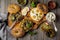 Sandwich from bread or bagels with tapenade, olives and boiled chicken eggs on an old wooden background. Selective focus. Top view