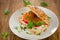 Sandwich with cereals bread and salmon on wooden table.