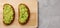 Sandwich with guacamole on light background. avocado on bread and wooden board baner breakfast concept