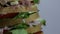 Sandwich with lettuce tomato cheese salami ham