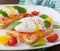 Sandwich with poached eggs with salmon