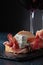 Sandwich with prosciutto, blue cheese and rosemary .