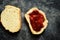 Sandwich with raspberry jam. Sandwich on a dark background isolated. Delicious raspberry and strawberry jam. Place for text. Top