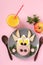 Sandwich with sausage and egg in the shape of a funny bull, symbol of the new 2021 on pink background, culinary idea breakfast for