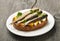 Sandwich with sprats and egg on wooden table