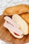 Sandwich turkey smoked ham tomato ketchup wooden board