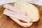 Sandwich turkey smoked ham tomato ketchup wooden board