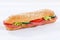 Sandwich whole grain grains baguette with salami ham on wooden b