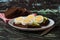 Sandwiches with avocado and egg, black whole grain bread. The concept of a proper breakfast