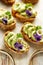 Sandwiches with avocado paste with the addition of edible flowers