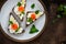 Sandwiches with cereals bread, salmon, fresh cheese, basil and lemon on plate. Top view, copy space