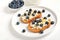Sandwiches with curd cheese, blueberries and honey
