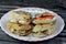 Sandwiches of Feta white cheese with slices of tomatoes and Traditional plain tahini halva or Halawa Tahiniya as basic tahini and