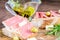 Sandwiches with fresh ham serrano and olive oil on the wooden table closeup. Healthy eating concept