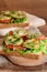 Sandwiches with fresh lettuce, sliced tomato, grilled zucchini dill and garlic