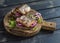 Sandwiches with grilled fish and quick pickled onions